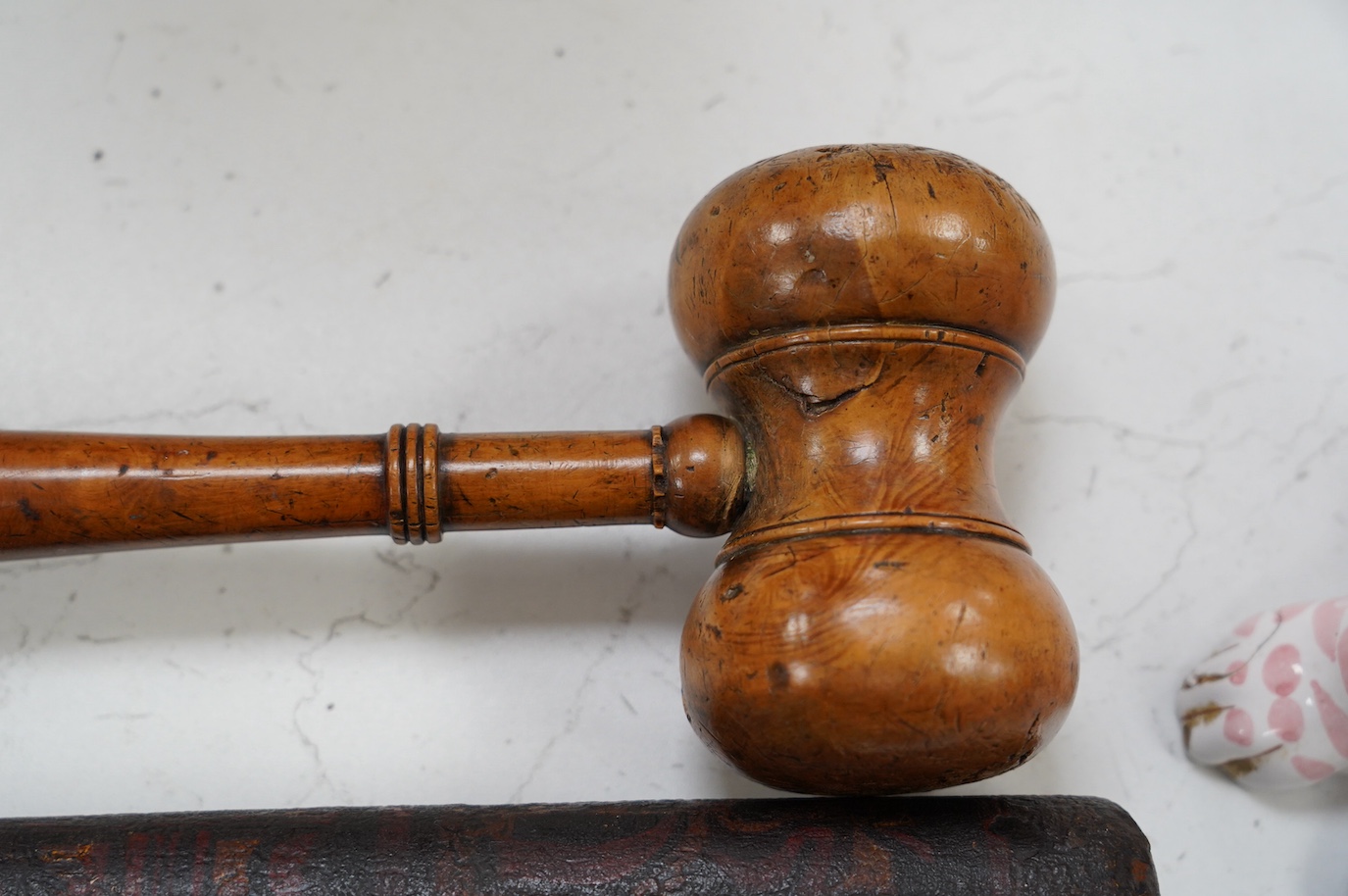 A large fruitwood gavel, a truncheon, a lead-weighted cosh and two others, longest 42cm. Condition - fair